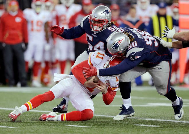 New England Patriots defensive tackle Malcom Brown (90) and New England Patriots linebacker Dont'a Hightower (54) tackle Kansas City Chiefs quarterback Alex Smith (11) in the second half of an NFL divisional playoff football game, Saturday, Jan. 16, 2016, in Foxborough, Mass. (AP Photo/Charles Krupa)