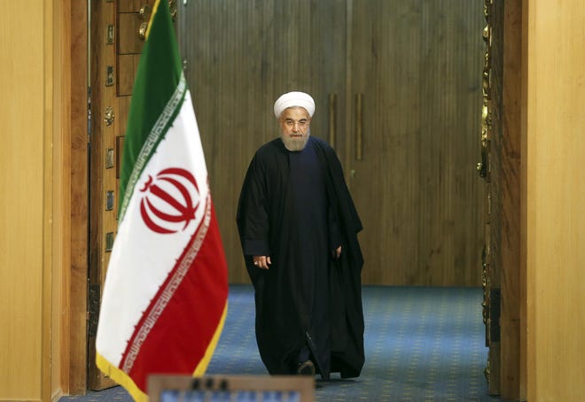 FILE - In this Sunday, Jan. 17, 2016 file photo, Iranian President Hassan Rouhani arrives for a news conference in Tehran, Iran. The end of nuclear-related sanctions and the flurry of diplomacy that led to the release of Americans held by Iran suggests a new era could be dawning in Tehran. That may well prove to be the case in time, both at home and abroad. But anyone hoping for rapid change is likely to be disappointed. (AP Photo/Ebrahim Noroozi, File)
