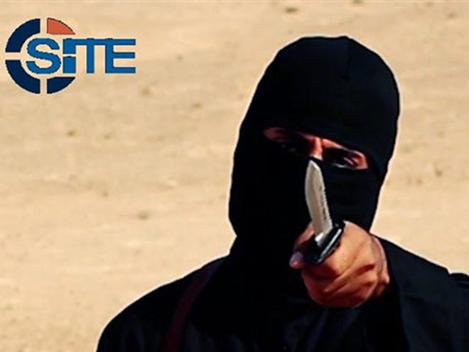 FILE - This image made from militant video, which has been verified by SITE Intelligence Group and is consistent with other AP reporting, shows Mohammed Emwazi, known as "Jihadi John," who appeared in several videos depicting the beheadings of Western hostages. SITE, which tracks terrorist activity, says the Islamic State group is acknowledging the death of the masked militant and published a "eulogizing profile" of him on Tuesday, Jan. 19, 2016, in its English-language magazine Dabiq.