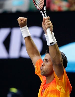 Fernando Verdasco of Spain celebrates after defeating his compatriot Rafael Nadal during their first round match at the Australian Open tennis championships in Melbourne, Australia, Tuesday, Jan. 19, 2016.