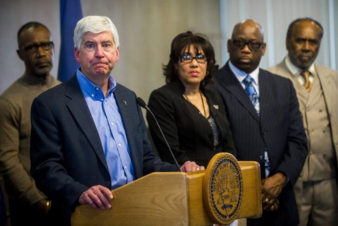 FILE - In a Monday, Jan. 11, 2016 file photo, Michigan Gov. Rick Snyder speaks during a news conference in Flint, Mich. the fallout from a water crisis in another impoverished city have marred the Republican's image as a practical problem-solver.Snyder is preparing to deliver his sixth State of the State address Tuesday, Jan. 19, where he will be met by a large protest that is likely to echo the withering criticism over Flint's water disaster coming from inside and outside of Michigan. (Jake May/The Flint Journal-MLive.com via AP, File) LOCAL TELEVISION OUT; LOCAL INTERNET OUT; MANDATORY CREDIT