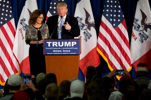 Former Alaska Gov. Sarah Palin, left, endorses Republican presidential candidate Donald Trump during a rally at Iowa State University on Tuesday, Jan. 19, in Ames, Iowa.