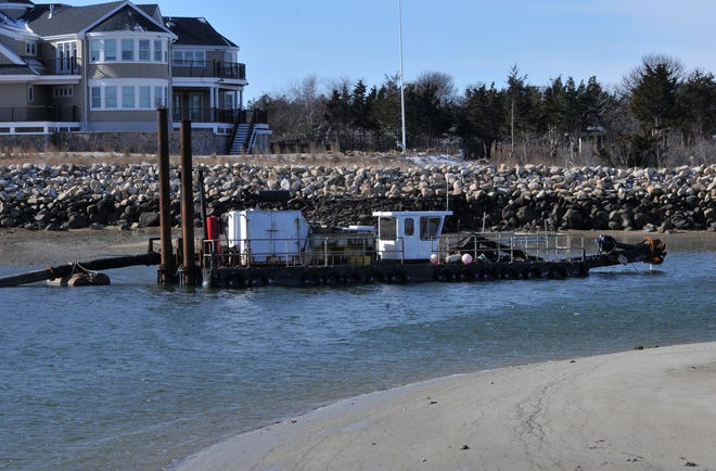 The Barnstable County dredge waits at the mouth of Barnstable Harbor to start clearing sand from the waterway. The project has fallen behind schedule because of a delay caused by the dredge working on an off-Cape project. Steve Heaslip/Cape Cod Times