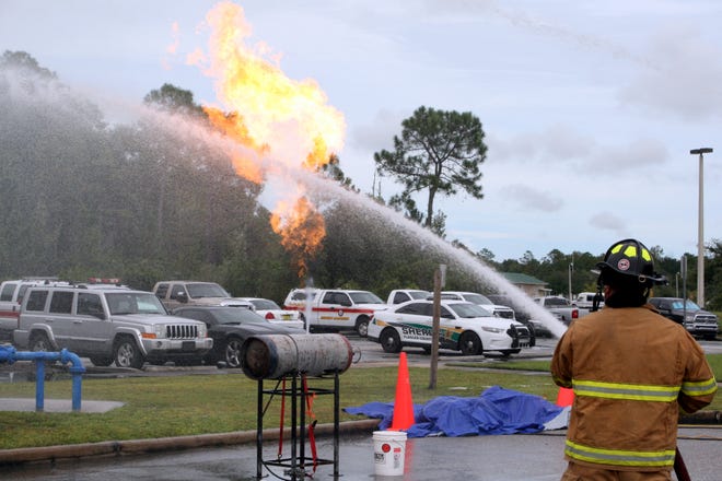 Putting out a compressed gas fire is one of the regular training exercises undertaken by Flagler County firefighters each year. County fire officials recently announced the hiring of five new employees and openings remain. PHOTO PROVIDED/FLAGLER COUNTY