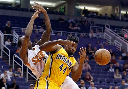Indiana Pacers' Solomon Hill (44) and Phoenix Suns' Archie Goodwin, left, collide as they both try to grab a rebound during the second half of an NBA basketball game Tuesday, Jan. 19, 2016, in Phoenix. The Pacers defeated the Suns 97-94. (AP Photo/Ross D. Franklin)