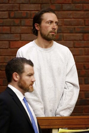 Ryan Palmer, 30, of Norwell appears with his lawyer, Patrick Reddington, at his arraignment Jan. 12.
