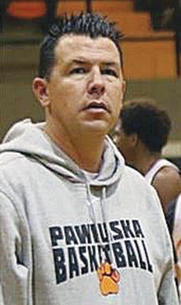 Ex-Huskie basketball coach awaits termination hearing