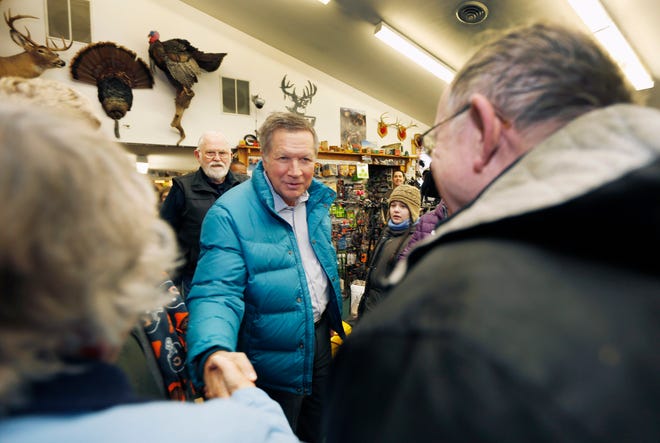 Republican presidential candidate, Ohio Gov. John Kasich shakes hands during a campaign stop at Morse Sporting Goods store, Tuesday, Jan. 19, 2016, in Hillsboro, N.H. (AP Photo/Jim Cole)