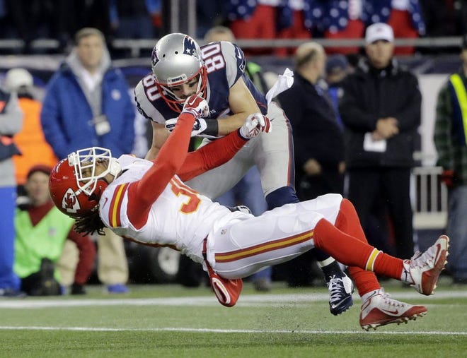 New England's Danny Amendola (80) crushes Kansas City's Jamell Fleming in the first half on Saturday.