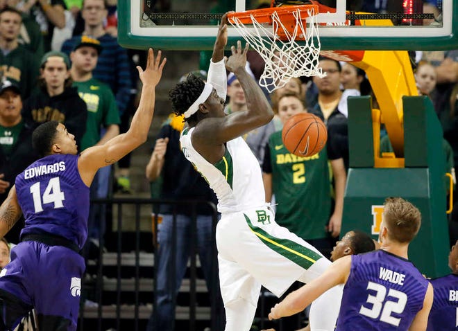 Baylor forward Johnathan Motley (5) dunks the ball as Kansas State's Justin Edwards (14) and Dean Wade (32) defend in the first half of an NCAA college basketball game, Wednesday, Jan. 20, 2016, in Waco, Texas. (AP Photo/Tony Gutierrez)