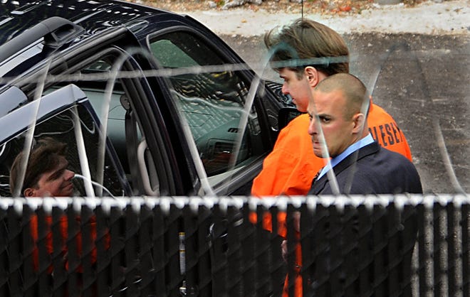 After his final court appearance, Neil Entwistle is taken from Middlesex Superior Court in Woburn to begin his life sentence on June 26, 2008. (Daily News staff file photo / Ken McGagh)