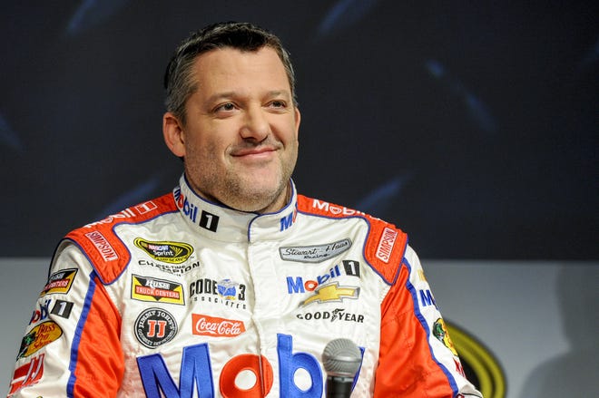 Stewart Haas Racing co-owner and driver Tony Stewart talks to members of the media during the NASCAR Charlotte (North Carolina) Motor Speedway Media Tour on Thursday. ASSOCIATED PRESS/MIKE MCCARN