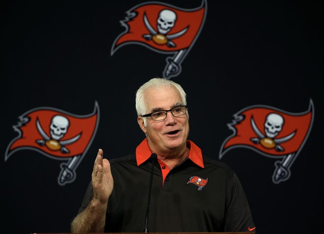 New Tampa Bay Buccaneers defensive coordinator Mike Smith gestures during a news conference Wednesday in Tampa. Smith had been a head coach with the Atlanta Falcons. ASSOCIATED PRESS/CHRIS O'MEARA