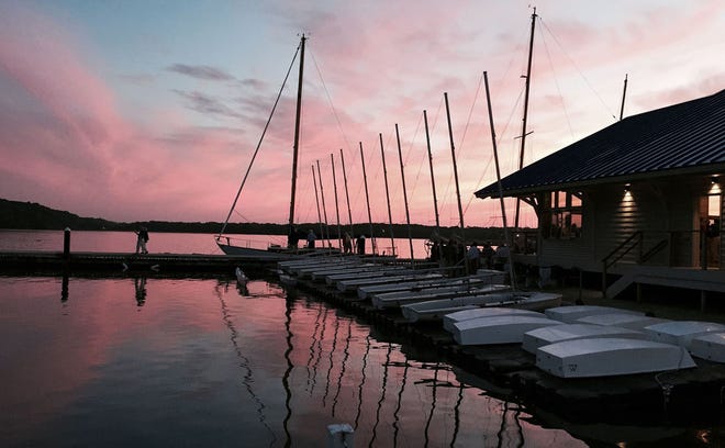 The sun sets over Presque Isle Bay and the Rickloff Community Boathouse at the Erie Yacht Club in Erie on July 10, 2015. CHRISTOPHER MILLETTE file photo/