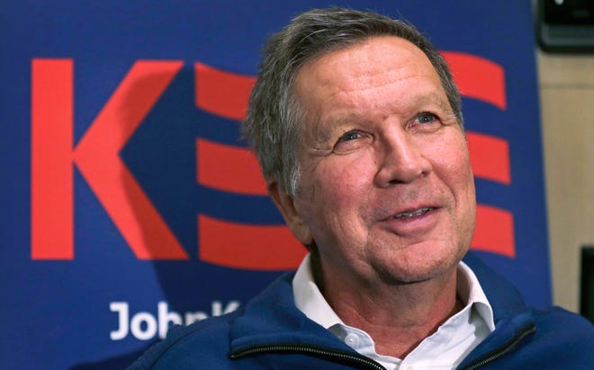 Republican presidential candidate, Ohio Gov. John Kasich answers a question during an interview on his campaign bus in Bow, N.H. on Jan. 20. (AP Photo/Charles Krupa)