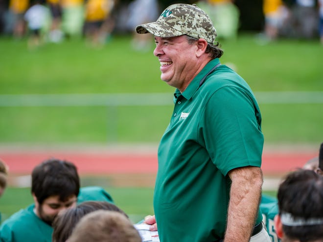JU head coach Kerwin Bell addresses the team after the game as the Jacksonville University Dolphins defeated the Valparaiso Crusaders 58-13 in the last game of the season at D.B. Milne Field at Jacksonville University on Saturday 21, 2015.