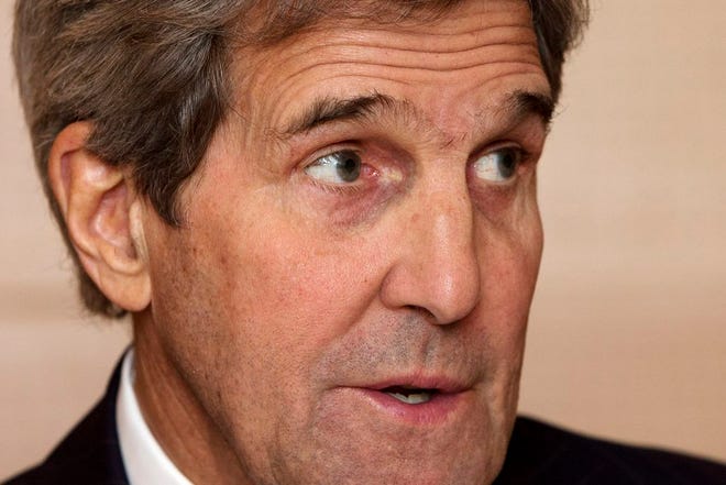 U.S. Secretary of State John Kerry speaks to members of the traveling media during the 2016 World Economic Forum in Davos, Switzerland, on Thursday, Jan. 21, 2016. Kerry’s trip is expected to last nine days and to encompass stops in Switzerland, Saudi Arabia, Laos, Cambodia, and China. (AP Photo/Jacquelyn Martin, Pool)