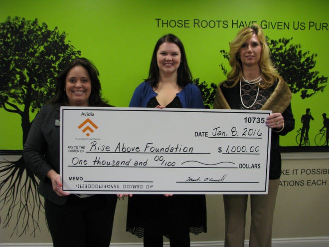 Presenting the check, from left, Rhiannon Hernandez, assistant vice president market manager of the Westborough Avidia Bank; Sarah Baldiga, co-founder and executive director of the Rise Above Foundation; and Kim Perkins, Westborough branch manager of Avidia Bank. Courtesy Photo