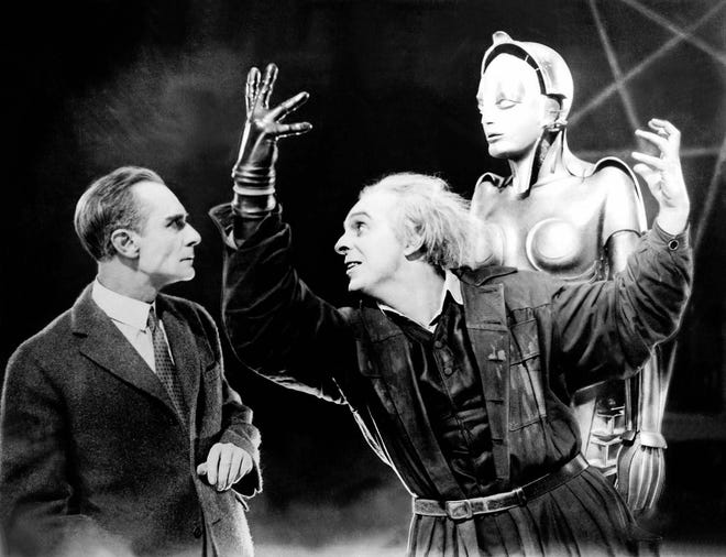 Industrialist Joh Frederson (Alfred Abel) looks on as scientist Rotwang (Rudolf Klein-Rogge) outlines his vision for a human-like robot in "Metropolis" (1927). The landmark science fiction film will be screened with live music by Jeff Rapsis on Friday, Jan. 29 at 7 p.m. at Exeter Town Hall, 9 Front St. Free admission; suggestion donation $5 with proceeds to benefit The Penn Program. Courtesy Photo
