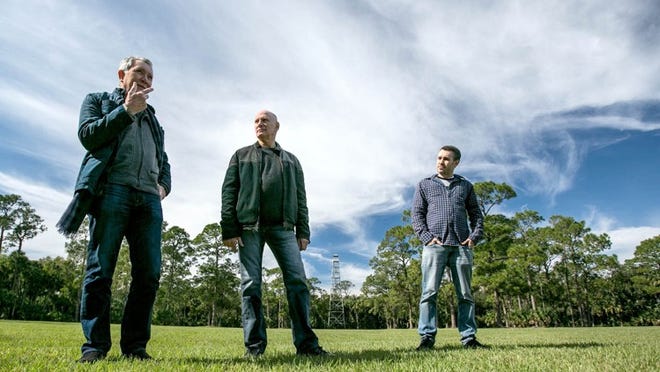 (l to r) Clifford Rosen, Steve Sybesma and Paul Peck, the organizers of the Okeechobee Music and Arts Festival, near what will be the main stage area of the inaugural festival. (Allen Eyestone / The Palm Beach Post)