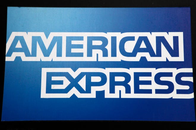 FILE - This Jan. 21, 2015, file photo, shows a sign for American Express outside a New York business. American Express reports quarterly financial results, Thursday, Jan. 21, 2016. (AP Photo/Mark Lennihan, File)