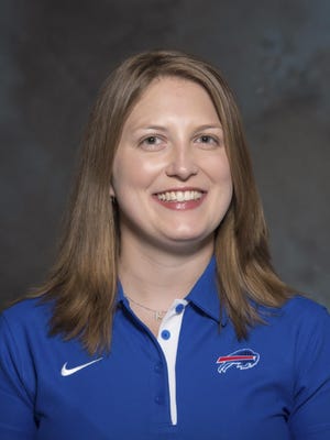 FILE - A May 2015 photo shows Kathryn Smith of the Buffalo Bills NFL football team. The Bills promoted Smith to be their special teams quality control coach, making her the first full-time female member of an NFL coaching staff. The team announced the move in a release Wednesday night, Jan. 20, 2016. Smith was an administrative assistant this season for Bills assistant coaches under Rex Ryan, with whom she has worked for seven years. (AP Photo/File)