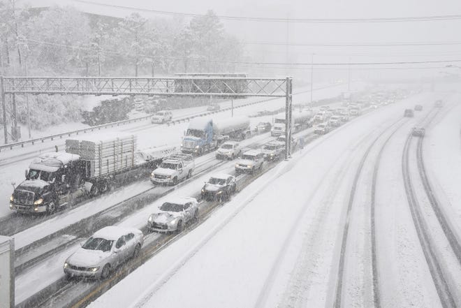 Treacherous conditions slow traffic on Interstate 40 in Nashville, Friday. Andrew Nelles/The Tennessean