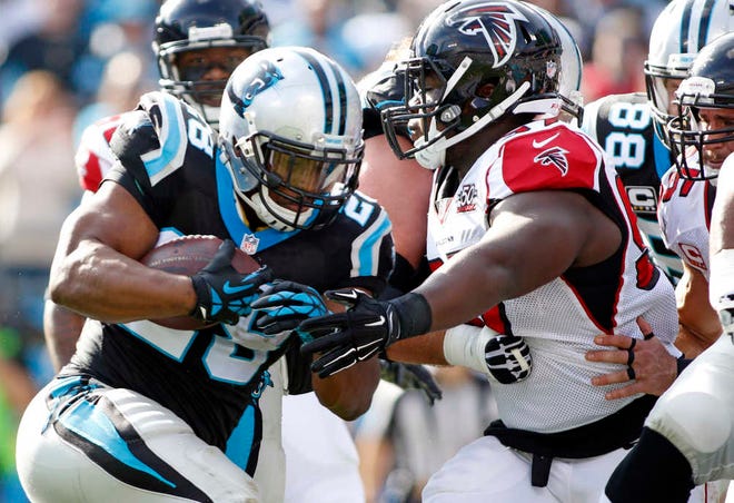 Carolina Panthers running back Jonathan Stewart runs against the Atlanta Falcons in the first half on Dec. 13 in Charlotte, N.C. The Panthers haven't missed a beat since releasing their all-time leading rusher Deangelo Williams in the offseason in large part because of the way Stewart has stepped up. (AP Photo/Bob Leverone)