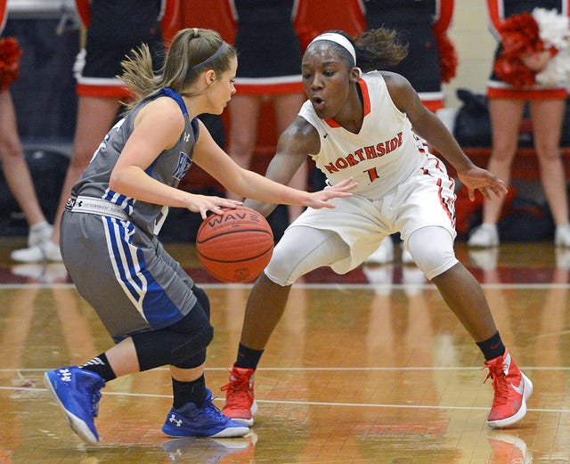 BRIAN D. SANDERFORD • TIMES RECORD Northside’s Aahliyah Jackson, right, guards Rogers’ Emma Wisdom as she brings the ball up the floor on Tuesday, Jan. 19, 2016 at Northside. Northside won the game 56-47.