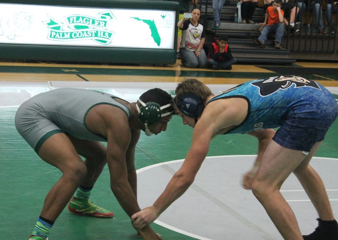 FPC's Eric Rosso, left, squares off against Matanzas' Chris Mixan in the 160-pound match. NEWS-TRIBUNE/ANDY MIKULA