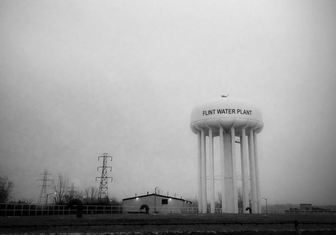 This Jan. 21, 2016, photo shows the water tower at the Flint water plant. Flint's mayor has floated a shockingly high price to fix the city's lead-contamination problem, saying it could take millions to replace damaged pipes. (Perry Rech/American Red Cross via AP)