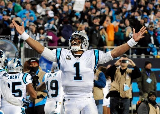 Carolina Panthers' Cam Newton celebrates Ted Ginn's run for a touchdown during the first half the NFL football NFC Championship game against the Arizona Cardinals, Sunday, Jan. 24, 2016, in Charlotte, N.C. (AP Photo/Mike McCarn)