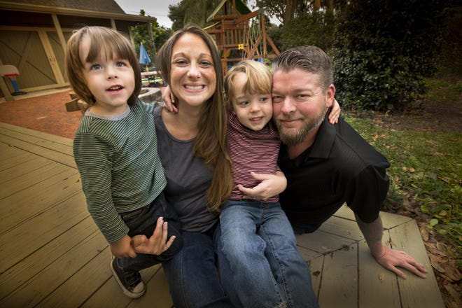 Heather Antonucci-Sims, left and her husband Jason Sims, right with their 3-year old twin sons Owen, left and William, in Lakeland. Heather gave birth Dec. 14 to her own niece. She served as surrogate mom for her sister, who lives in N.Y. An embryo with DNA from her sister and brother-in-law was implanted in her.