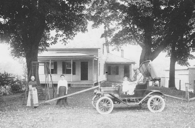 Photo by Jennie Sweetman — The Hamilton Family stands in front of their McAfee house, a dwelling known today as the Perry Homestead on Route 94 of the McAfee section of Vernon Township.