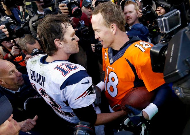 New England Patriots quarterback Tom Brady and Denver Broncos quarterback Peyton Manning speak to one another after the NFL football AFC Championship game Sunday in Denver. The Broncos defeated the Patriots 20-18 to advance to the Super Bowl. AP PHOTO/DAVID ZALUBOWSKI