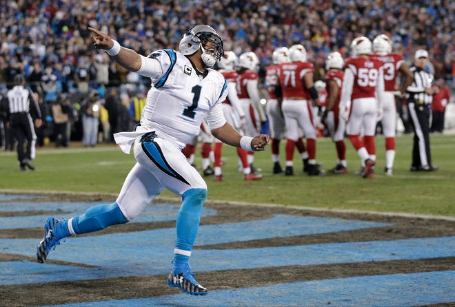 Carolina Panthers' Cam Newton celebrates his touchdown run during the first half the NFL football NFC Championship game against the Arizona Cardinals, Sunday, Jan. 24, 2016, in Charlotte, N.C.