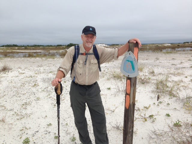 Jerry Ogle at the start of the Florida National Trail in Fort Pickens.