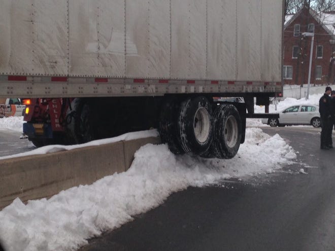 A tractor trailer got stuck on the concrete median on the entrance ramp to Interstate 80 at Park Avenue in Stroudsburg. Helen Yanulus/Pocono Record