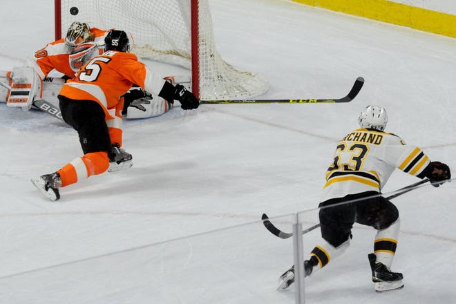 Boston's Brad Marchand rips a first-period goal past Michal Neuvirth.