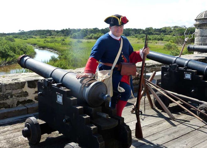 SUE.BJORKMAN@STAUGUSTINE.COM Interpretive Ranger Allen Arnold dresses the part of an 18th century Spanish soldier as he prepares to do a cannon demonstration at Fort Matanzas.