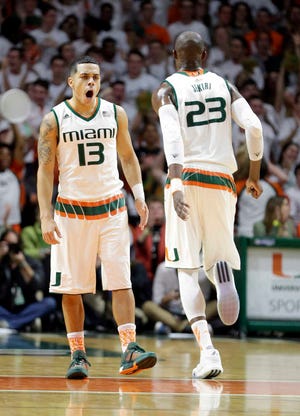 Miami guard Angel Rodriguez celebrates after scoring a three-pointer against Duke during the first half on Monday in Coral Gables. (AP Photo/Alan Diaz)