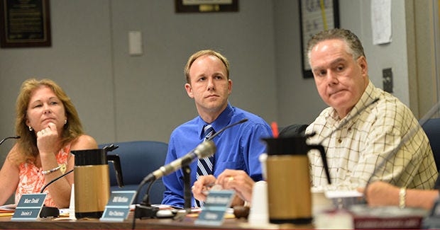 Lake County School board members Stephanie Luke, left, Marc Dodd and Bill Mathias listen during a meeting at the Lake County School Board District Office in Tavares. Lake County School Board members expressed reservations Monday about several school improvement plans that they say are too broad and unrealistic.