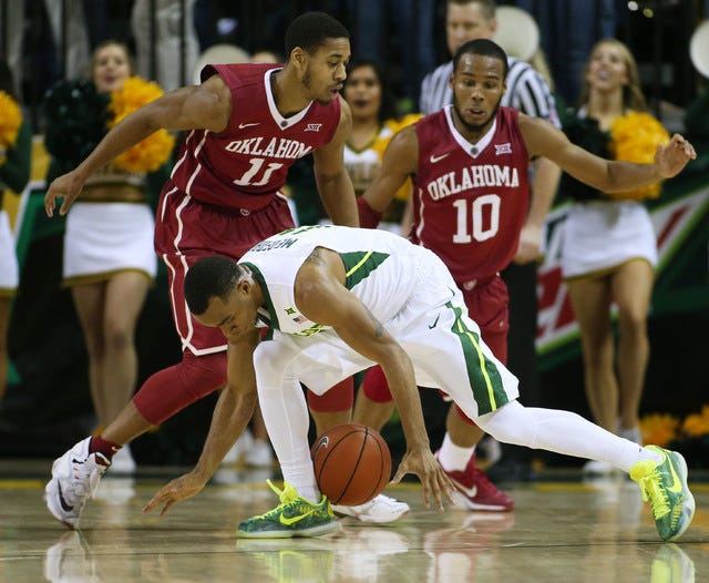 Baylor Bears guard Lester Medford (11) loses the ball in front of Oklahoma Sooners guards Isaiah Cousins (11) and Jordan Woodard (10) at the Ferrell Center in Waco, Texas, on Saturday, Jan. 23, 2016. Oklahoma won 82-72. (Erich Schlegel-USA TODAY Sports)