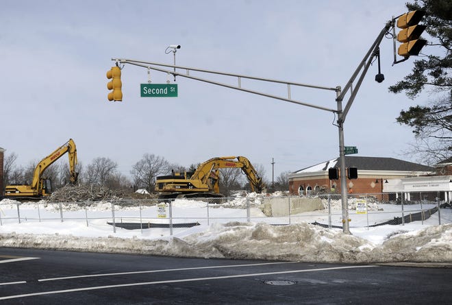 Crews continue the demolition of the old Moorestown library at Church and Second streets Tuesday, Jan. 26, 2016, opening up the view to the municipal complex where the new library and town hall are located. The new library, which was blocked by the old, can be seen in the background.