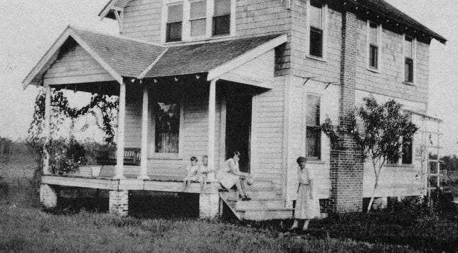 Duttenhaver House built in Bimini by Henry Ernest. From left, Marie, Wayne, Ruby Ethel and Lillie B. Wildasin Duttenhaver at the family homestead. FLAGLER COUNTY HISTORICAL SOCIETY
