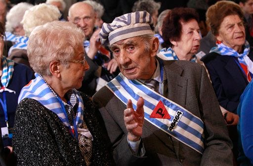 Holocaust survivors attend a ceremony at the former Auschwitz Nazi death camp in Oswiecim, Poland, Wednesday, Jan. 27, 2016, the 71st anniversary of the death camp's liberation by the Soviet Red Army in 1945. (AP Photo/Czarek Sokolowski)