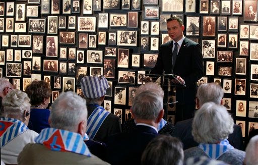 Polish President Andrzej Duda speaks during a ceremony at the former Auschwitz Nazi death camp in Oswiecim, Poland, Wednesday, Jan. 27, 2016, the 71st anniversary of the death camp's liberation by the Soviet Red Army in 1945. (AP Photo/Czarek Sokolowski)