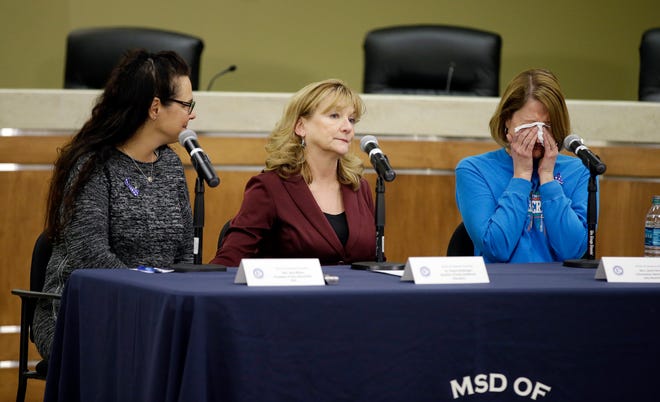 Amy Bilyeu, from left, Deanna Renbarger and Jamie Strebing speak during a news conference Wednesday in Indianapolis. The group shared memories of Susan Jordan, the principal of Amy Beverland Elementary School, who was killed when a bus suddenly lurched forward Tuesday afternoon. Two 10-year-old children were hospitalized with serious injuries that were not life threatening. DARRON CUMMINGS/THE ASSOCIATED PRESS