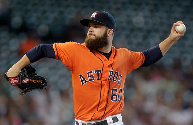 Houston Astros pitcher Dallas Keuchel throws during the first inning of a baseball game against the Miami Marlins, Friday, July 25, 2014, in Houston. (AP Photo/Patric Schneider)
