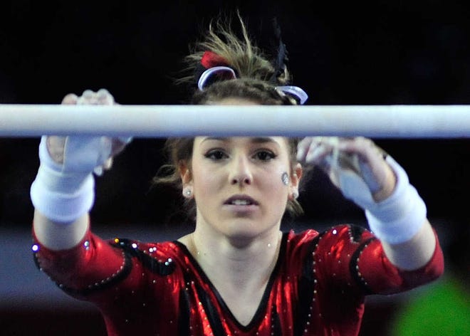 Gymdog Natalie Vaculik performs on the uneven bars during a meet against Stanford on Monday, Jan. 18, 2016 in Athens, Ga. (Richard Hamm/Staff) OnlineAthens / Athens Banner-Herald